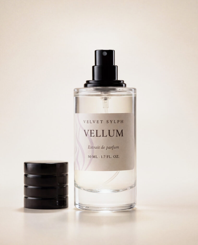 Vellum extrait de parfum with the cap off, sprayer showing